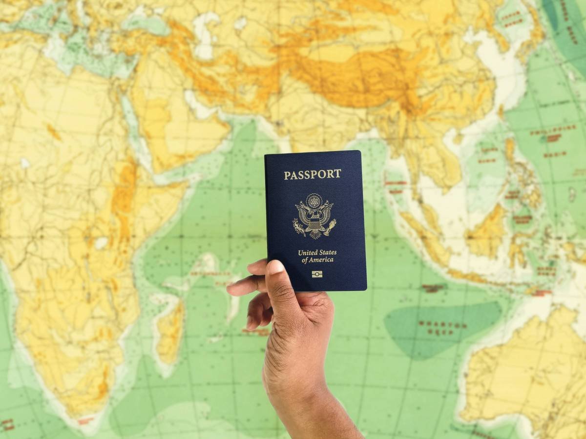 Infographic showing steps of passport replacement assistance: report loss → call credit card benefit line → administrator contacts embassy → submit docs → receive temporary passport