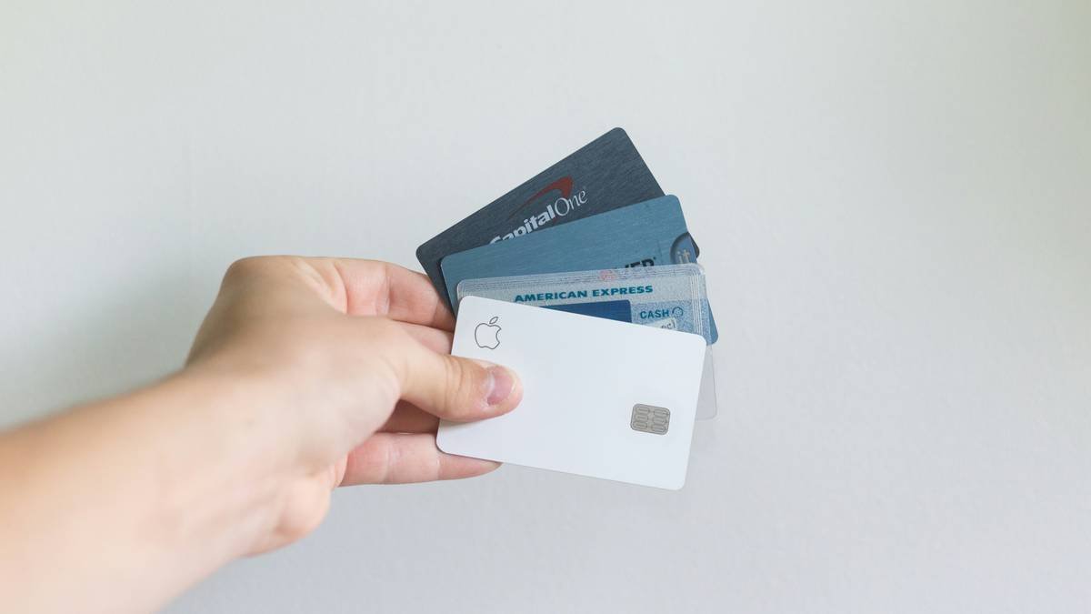 executive reviewing credit card travel business travel insurance policy details on laptop