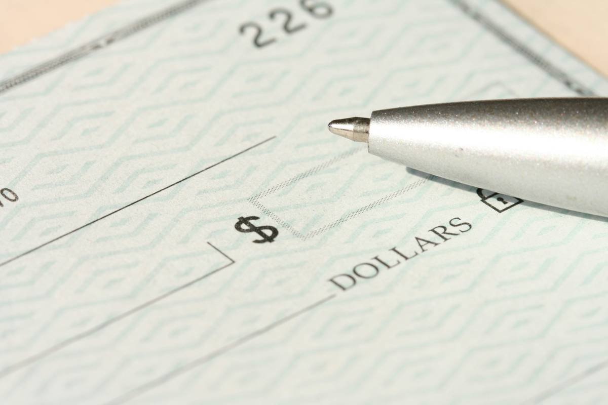 Traveler using phone to call credit card travel insurance emergency passport replacement service abroad