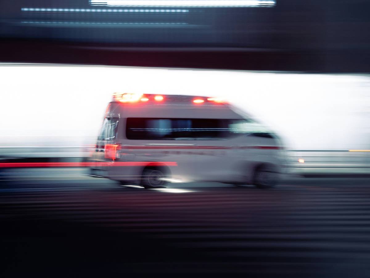 Traveler using credit card travel insurance emergency transport service after mountain accident