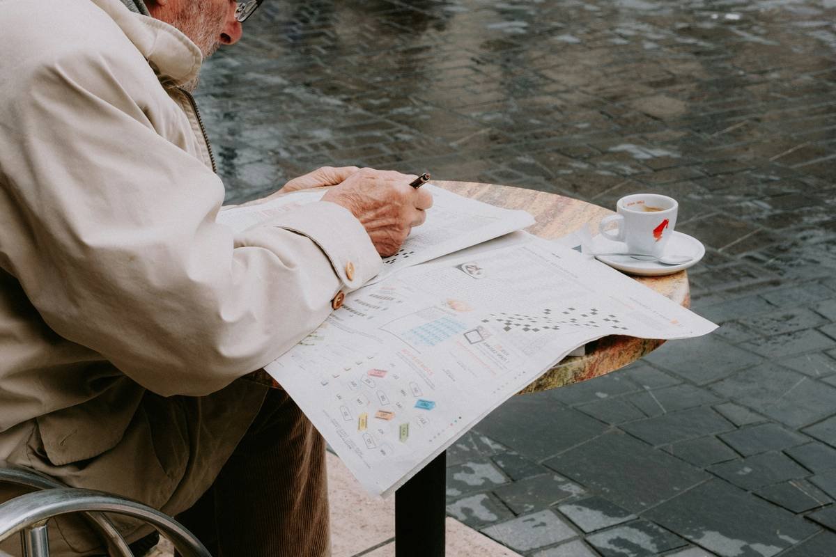 Senior couple reviewing credit card travel senior travel insurance documents at airport